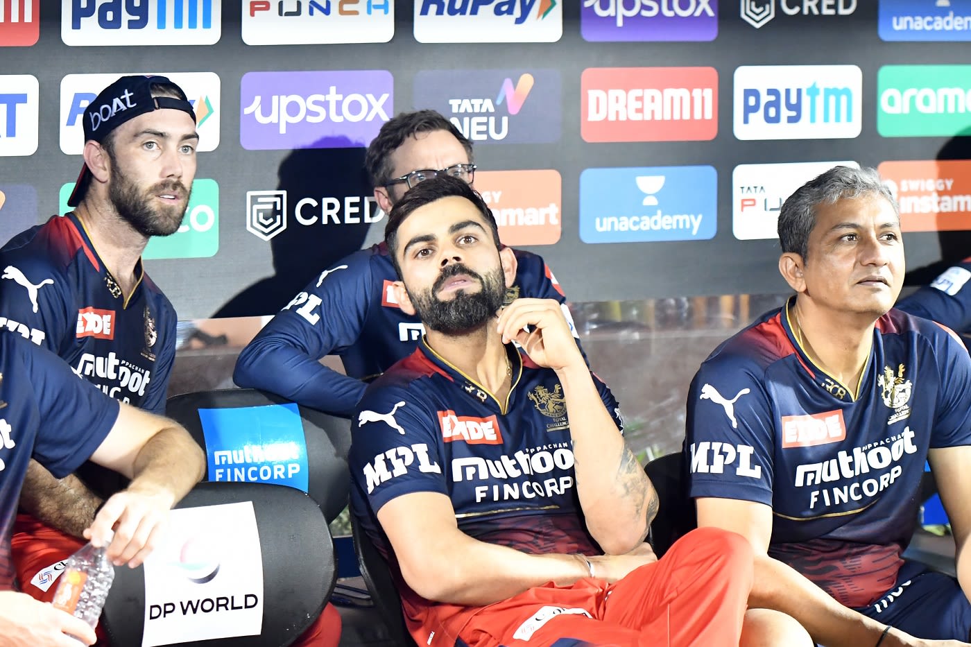 Damage done: Glenn Maxwell, Virat Kohli and Sanjay Bangar try to make sense of their side's collapse