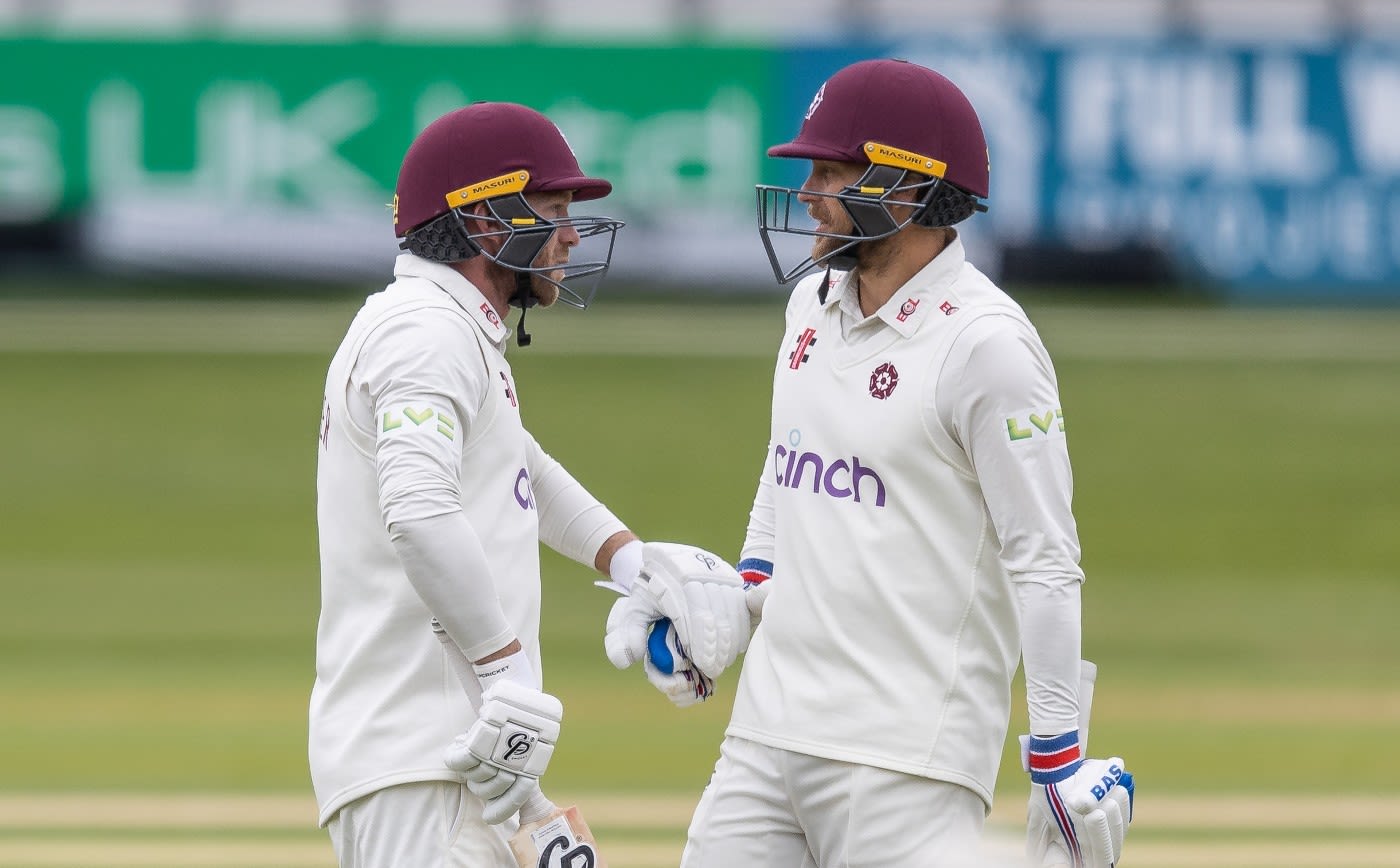 Luke Procter is congratulated by team-mate Gareth Berg on reaching his century