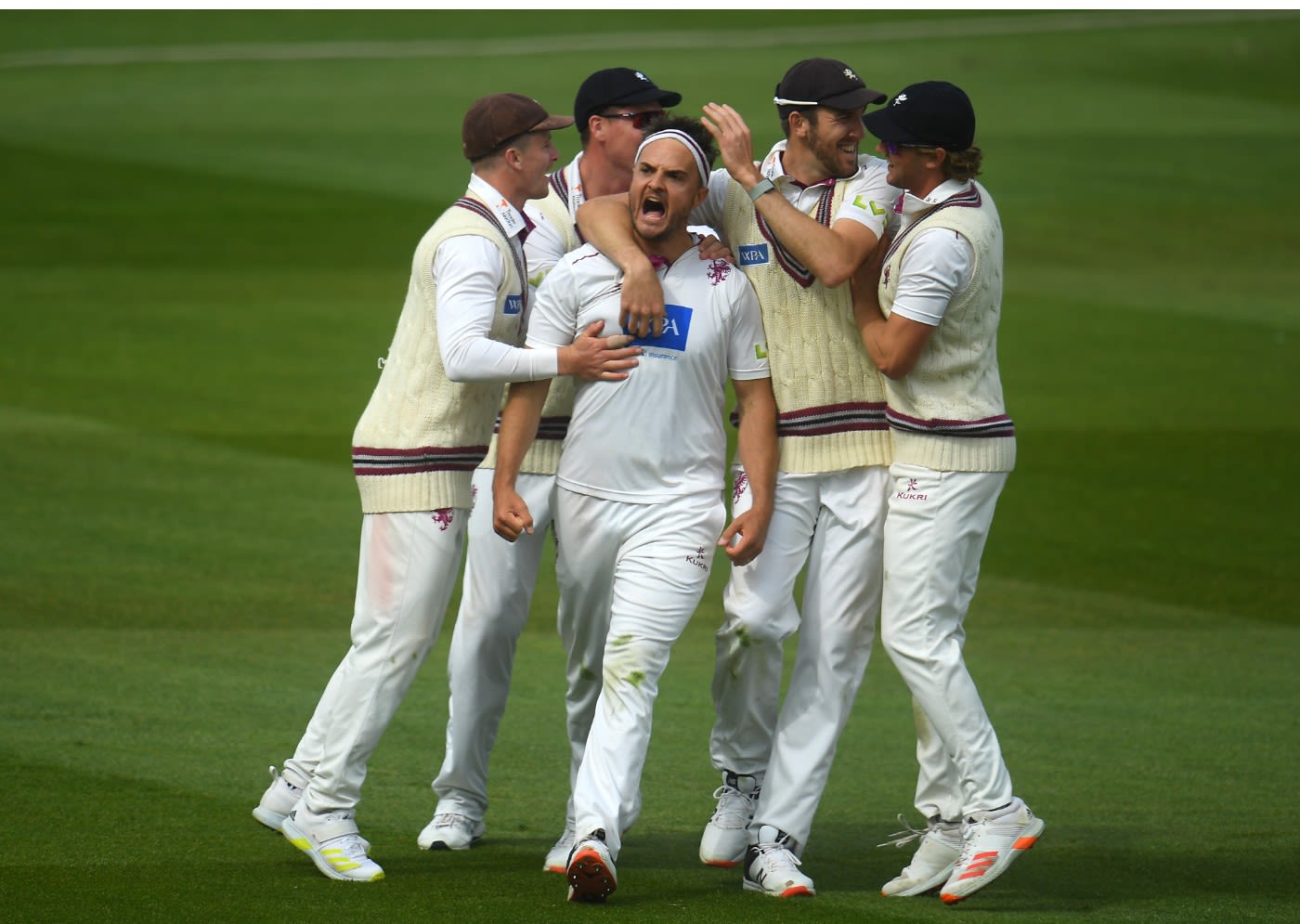 Jack Brooks of Somerset celebrates after taking the wicket of Danny Briggs