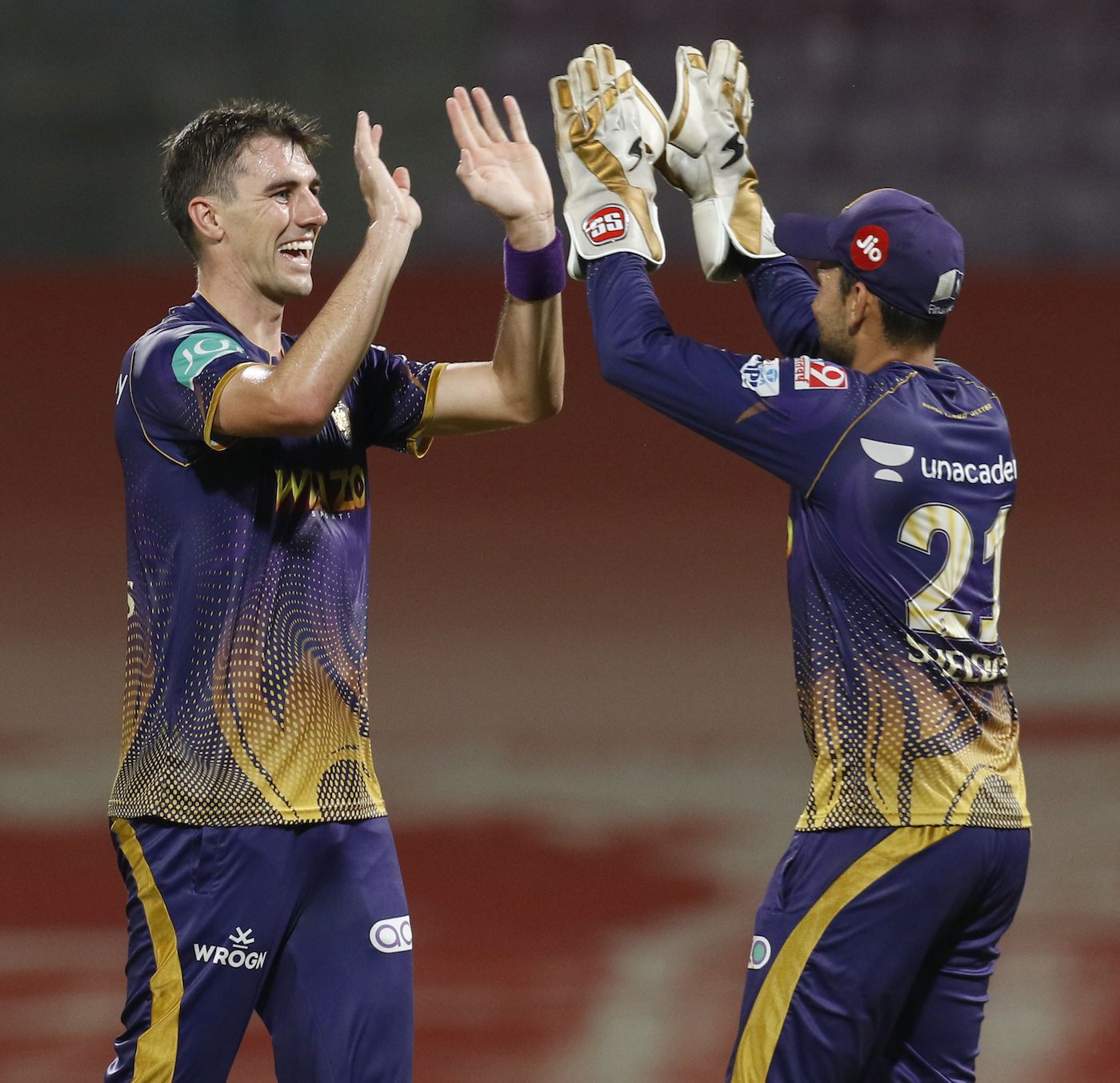Pat Cummins and Sheldon Jackson celebrate after combining to remove Daniel Sams