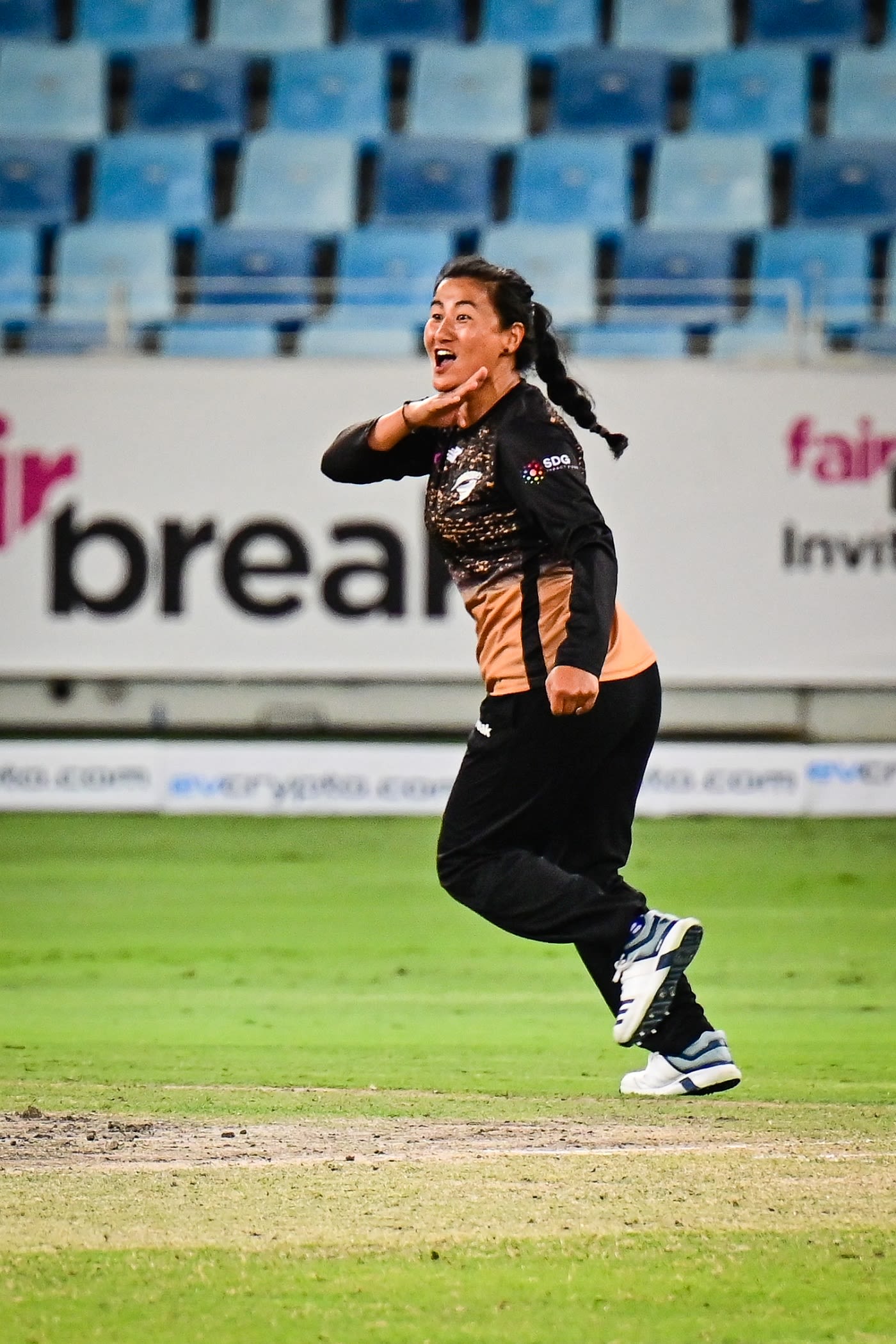 Sita Rana Magar celebrates in her trademark manner after dismissing Sophia Dunkley