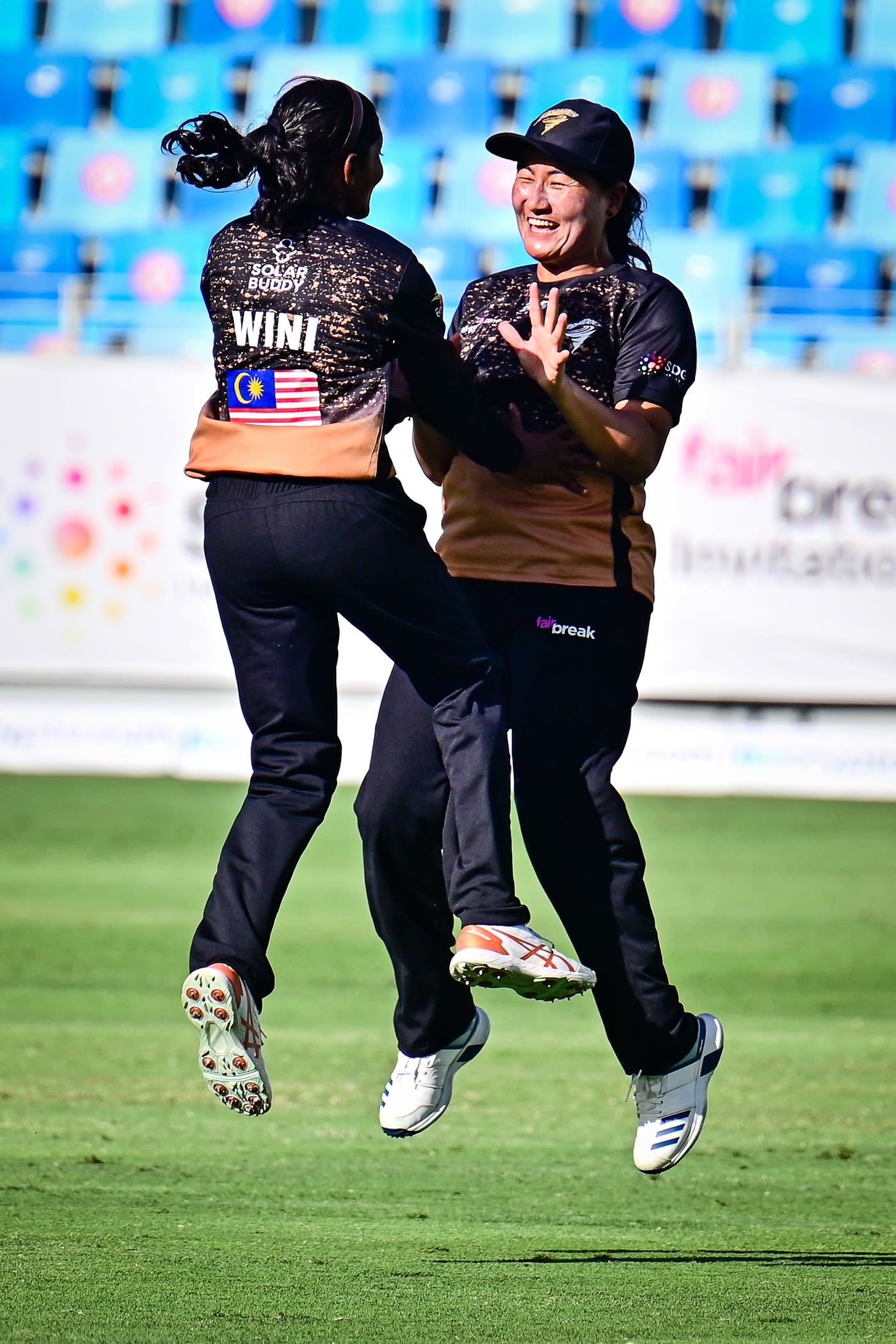Winifred Duraisingam and Sita Rana Magar celebrate a wicket
