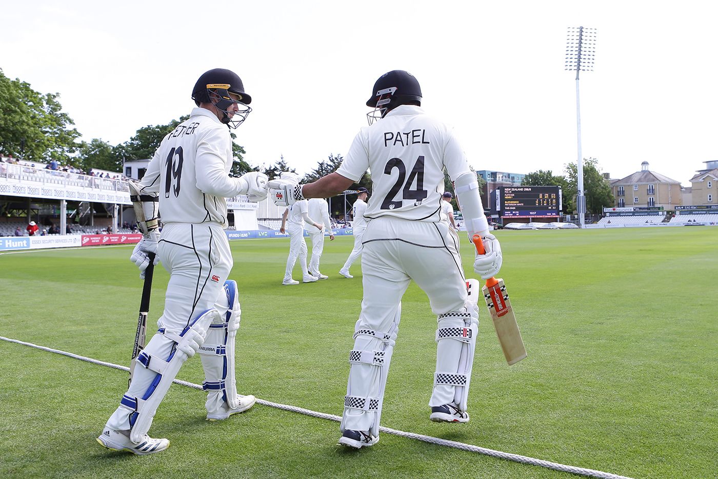 Cam Fletcher and Ajaz Patel head out to bat