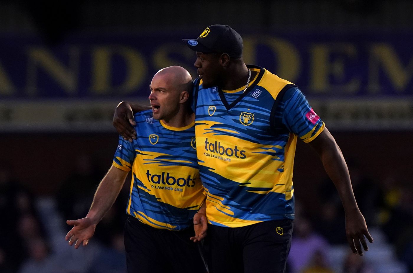 Jake Lintott gets a hug from Carlos Brathwaite