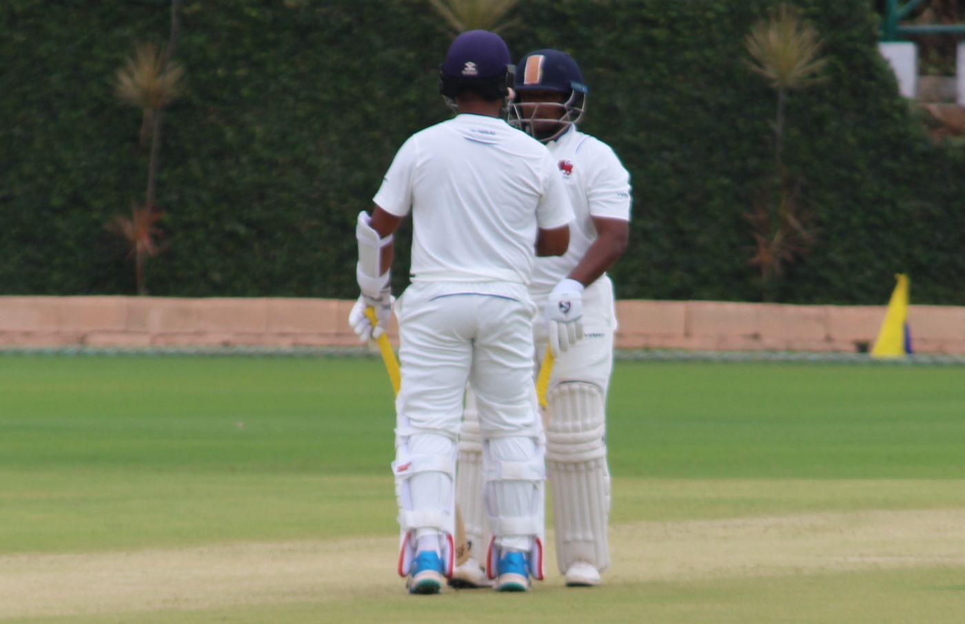 Century-makers Darfaraz Khan and Suved Parkar have a mid-pitch conference
