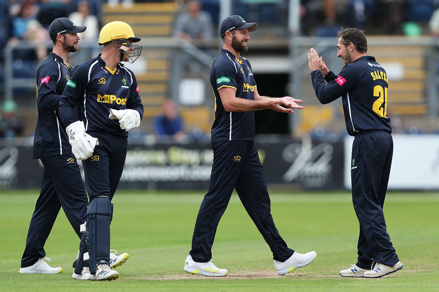 Michael Neser is congratulated by Andrew Salter after catching Tom Alsop