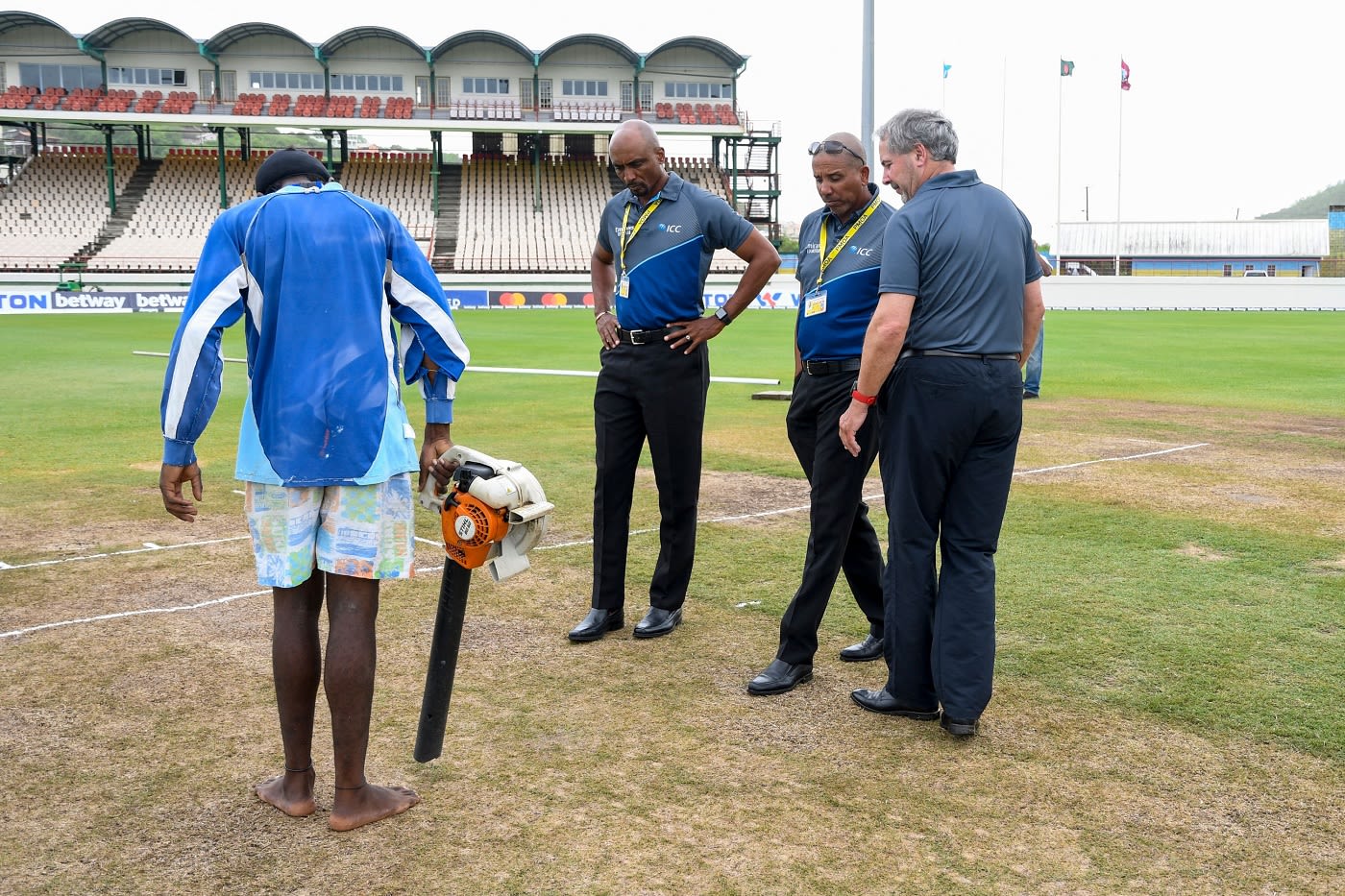 Match officials Joel Wilson, Gregory Brathwaite and Richard Illingworth inspect the surface