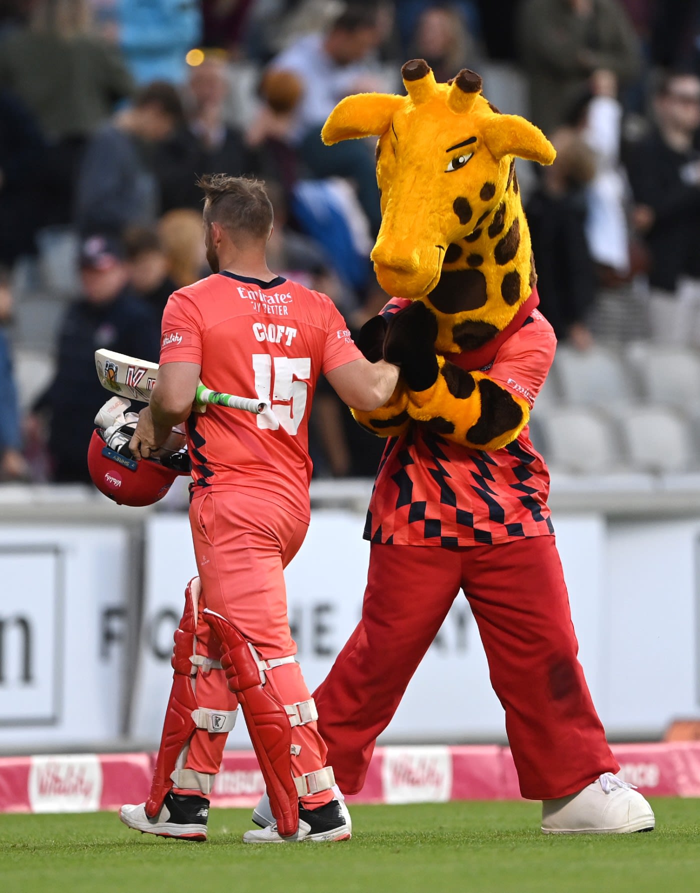Steven Croft is congratulated by Lanky the Giraffe after securing Lancashire's Finals Day berth