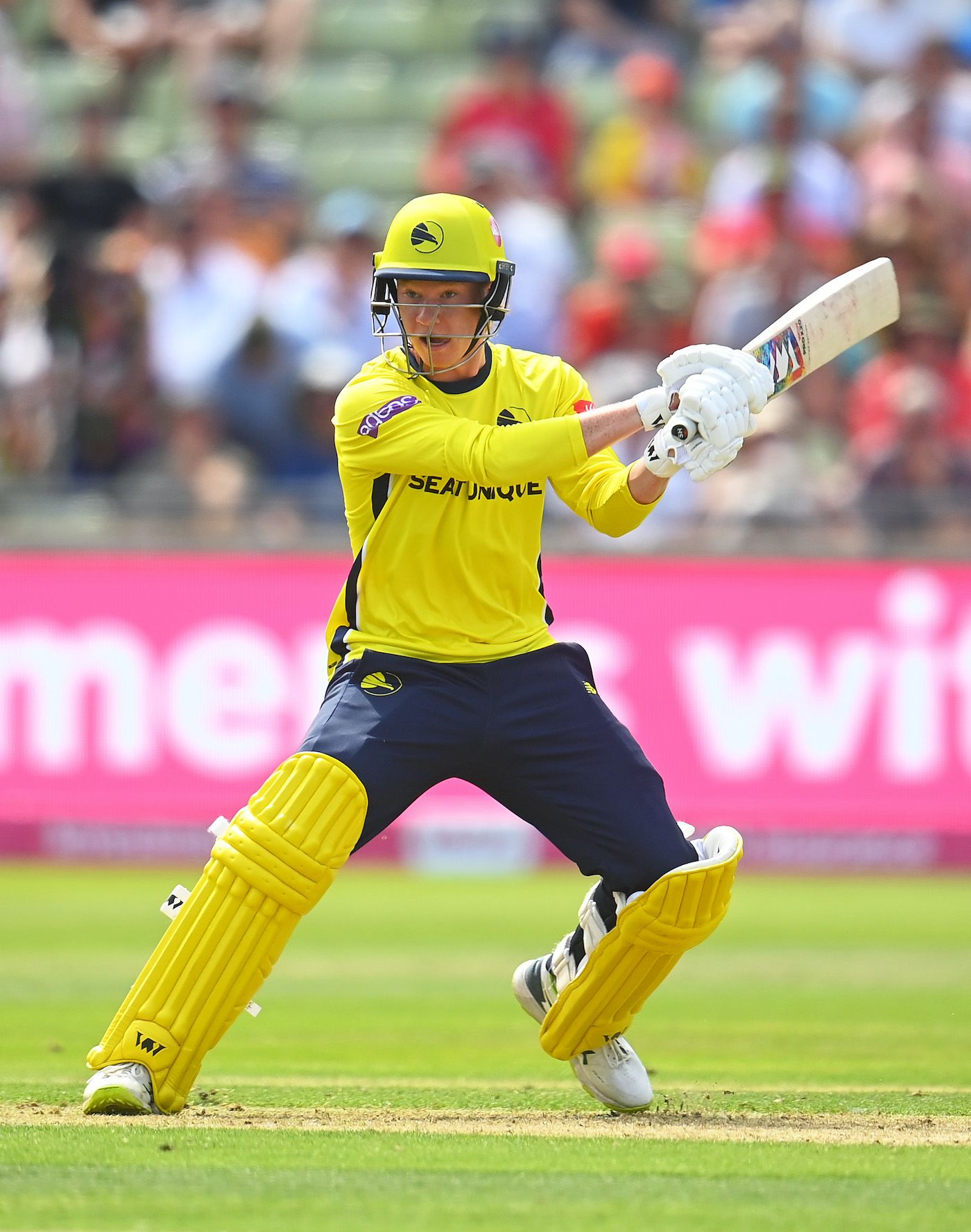 Tom Prest goes for a cross-batted shot