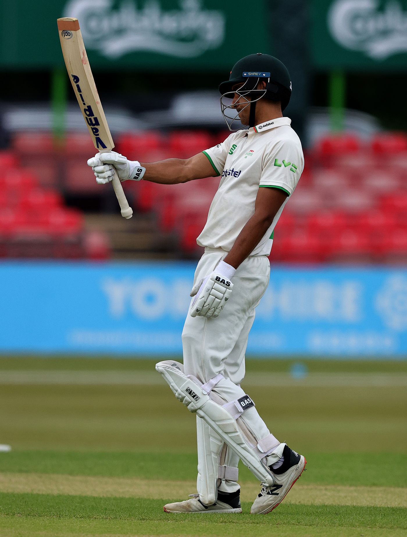 Ben Mike acknowledges the applause for his half-century
