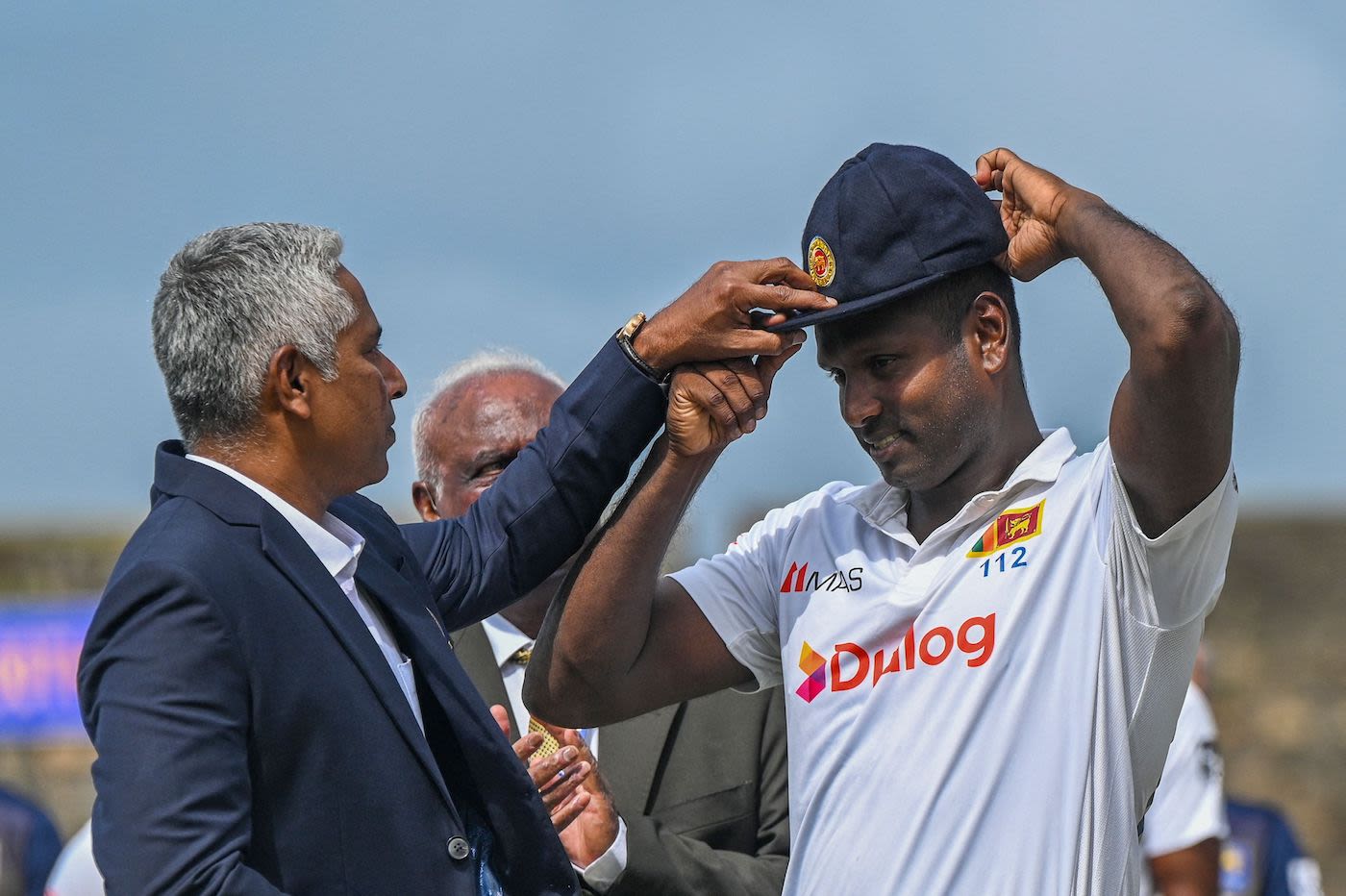 Angelo Mathews gets a cap to mark the occasion of his 100th Test appearance from Chaminda Vaas