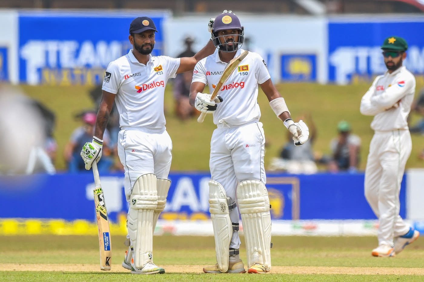 Oshada Fernando celebrates his fifty with Dimuth Karunaratne