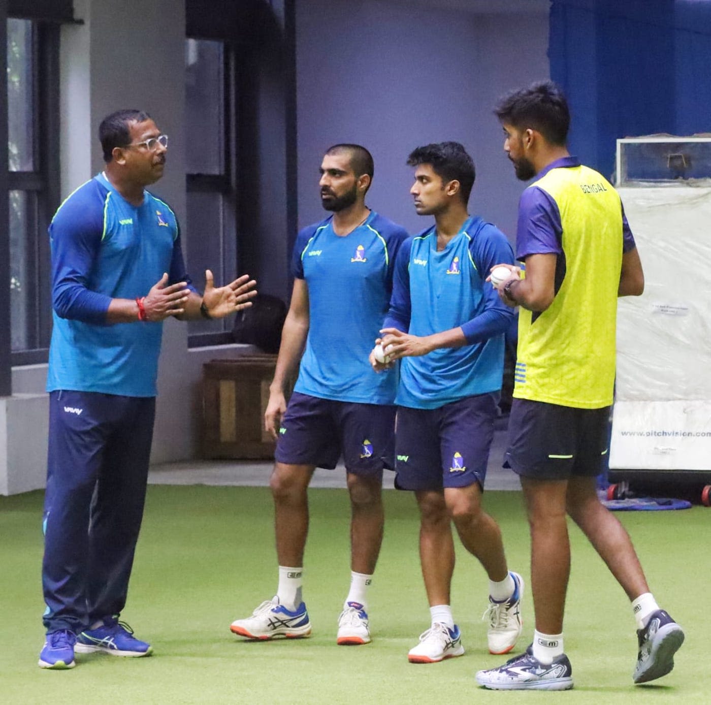Shib shankar Paul (left) chats to Mohammed Kaif, Sayan Sekhar Mondal, and Ishan Porel (left to right, in order) during Bengal's pre-season training