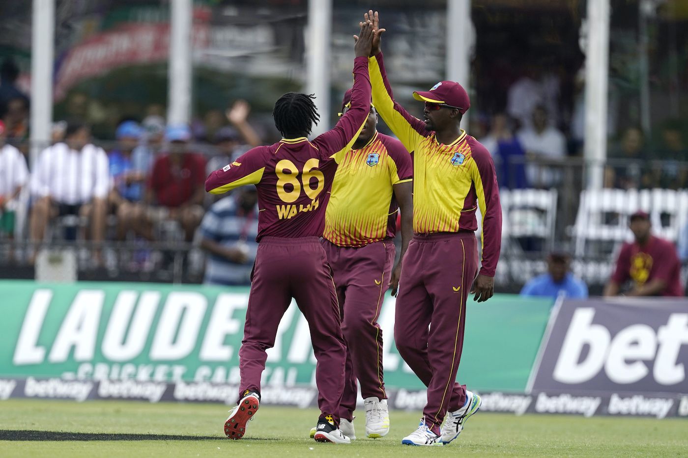 Hayden Walsh celebrates with Shamarh Brooks after dismissing Deepak Hooda