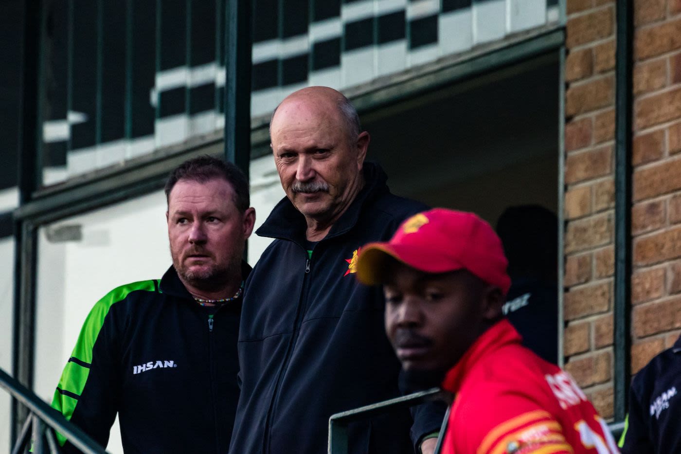 Zimbabwe head coach Dave Houghton and batting coach Lance Klusener watch proceedings after his team's series-sealing chase