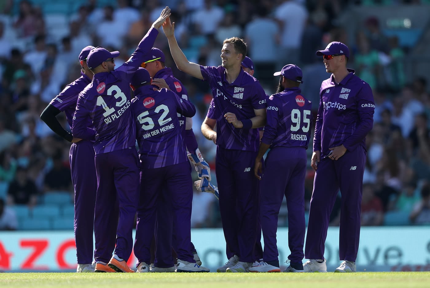 Craig Miles celebrates the wicket of Sunil Narine with his teammates