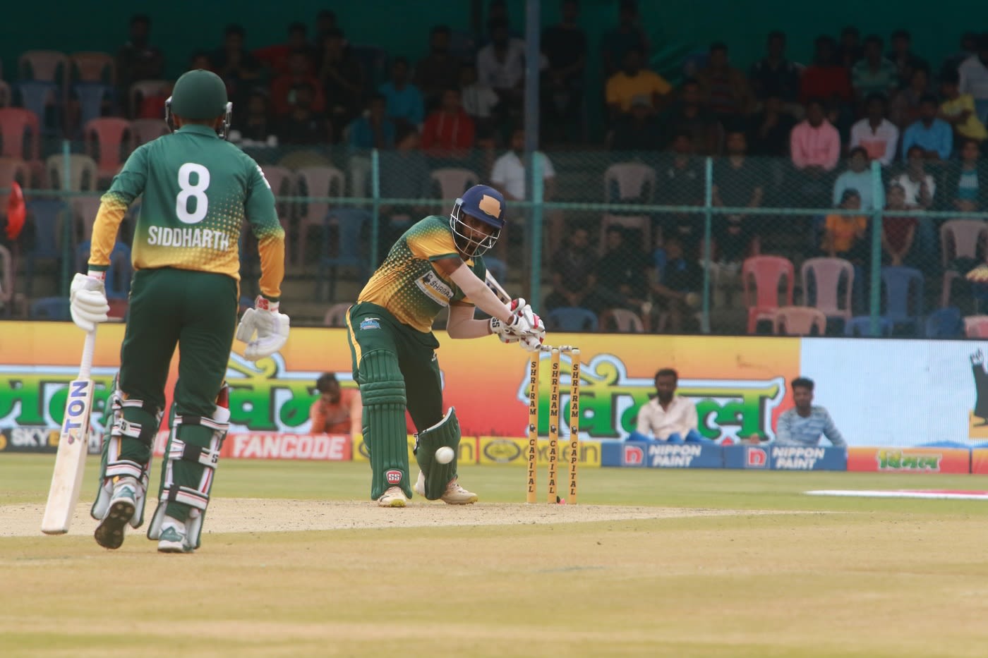 Rohan Kadam prepares to swat one down the ground