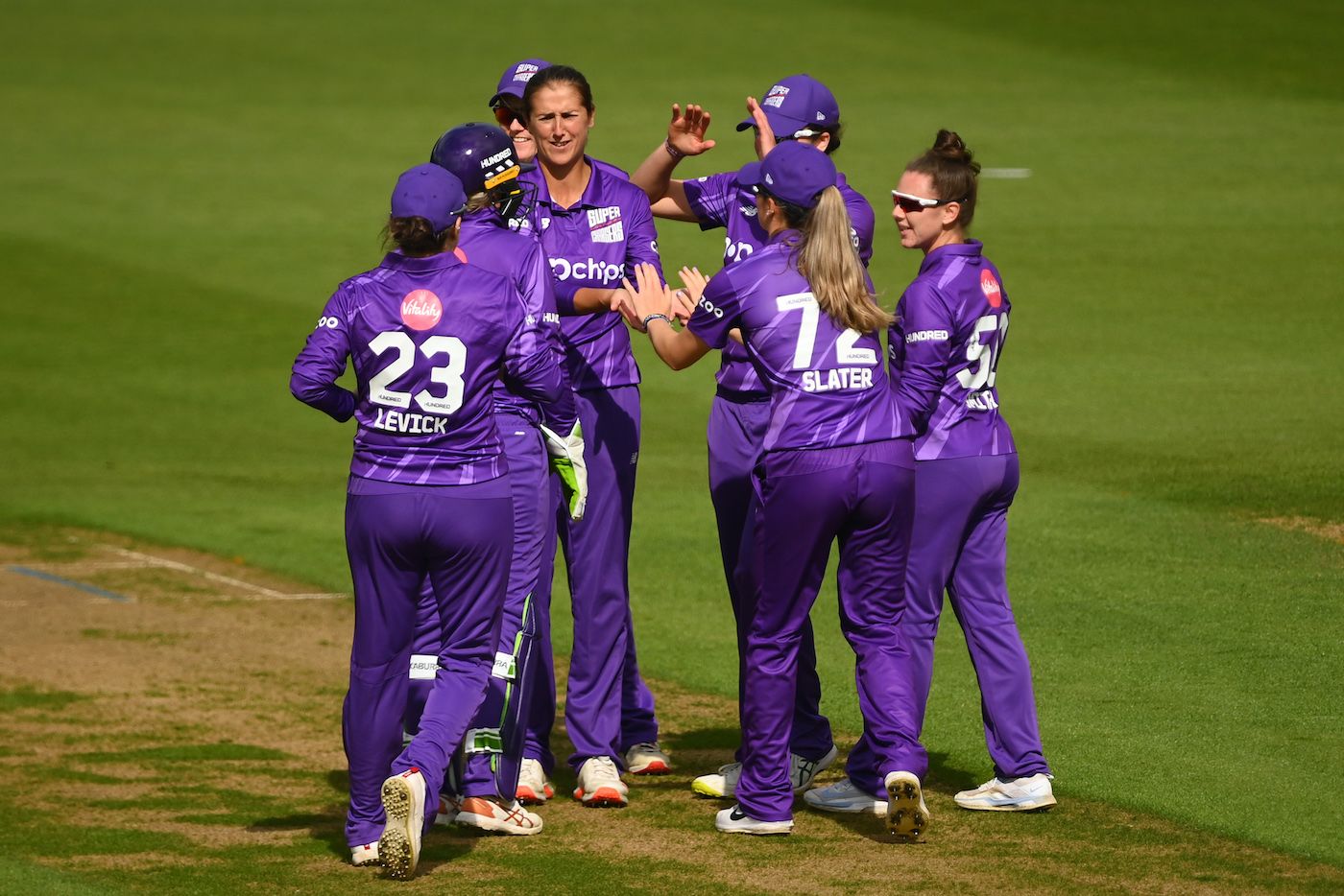 Jenny Gunn celebrates after picking up a wicket