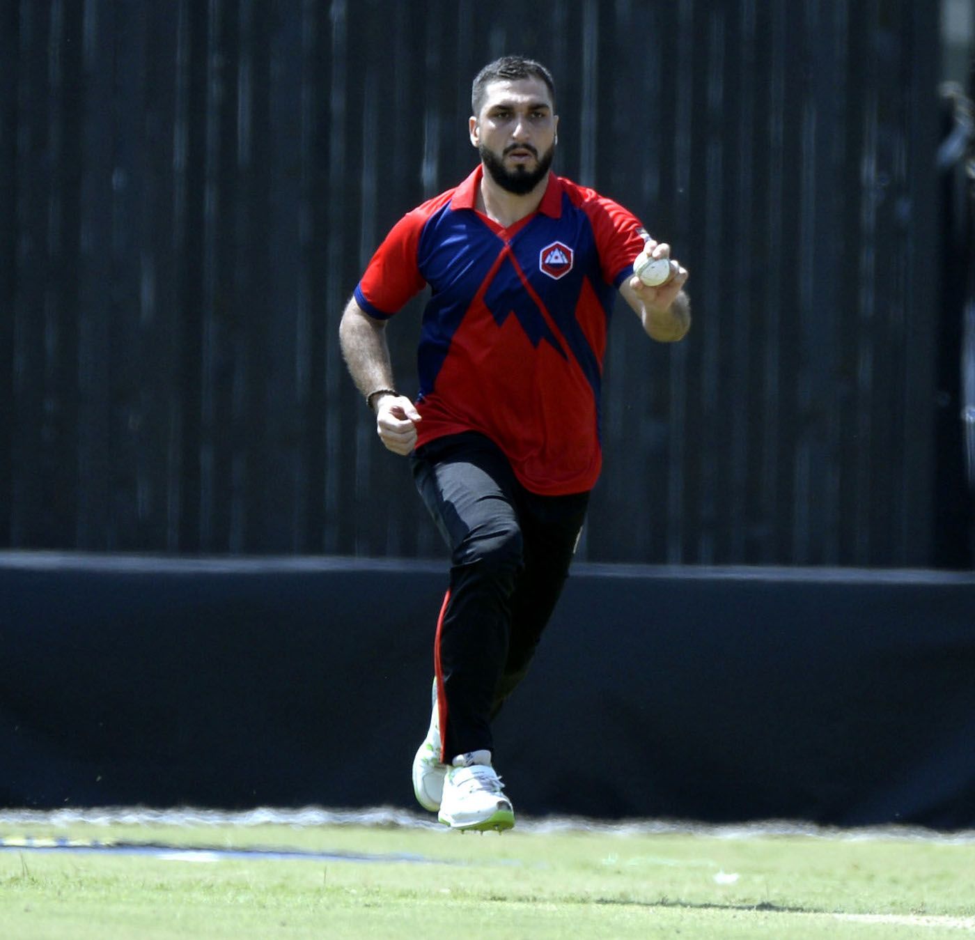 Usman Shinwari runs in to bowl