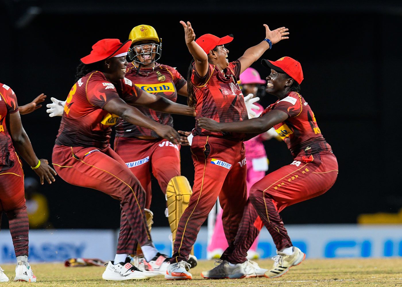 Anisa Mohammed is embraced by team-mates after taking the final wicket