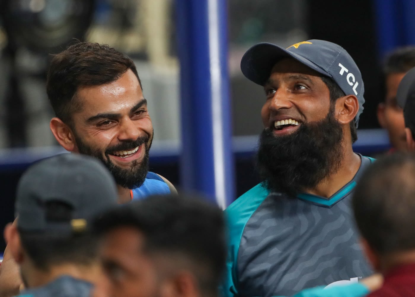 Virat Kohli and Mohammad Yousuf share a light moment after the match