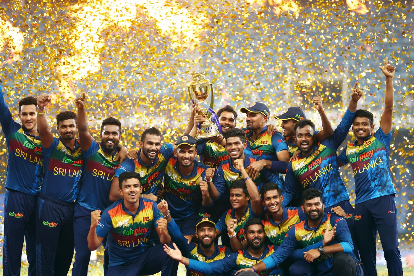 All smiles: Sri Lanka with the Asia Cup trophy