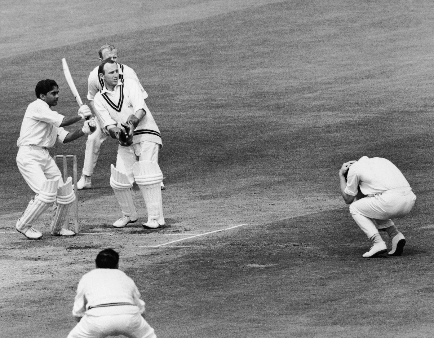 A fielder cowers as Hanumant Singh plays a shot