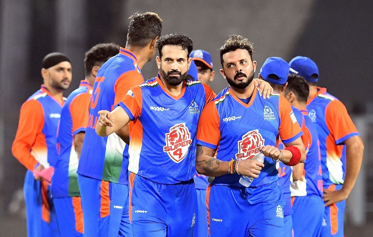 Irfan Pathan has a chat with S Sreesanth after picking up a wicket