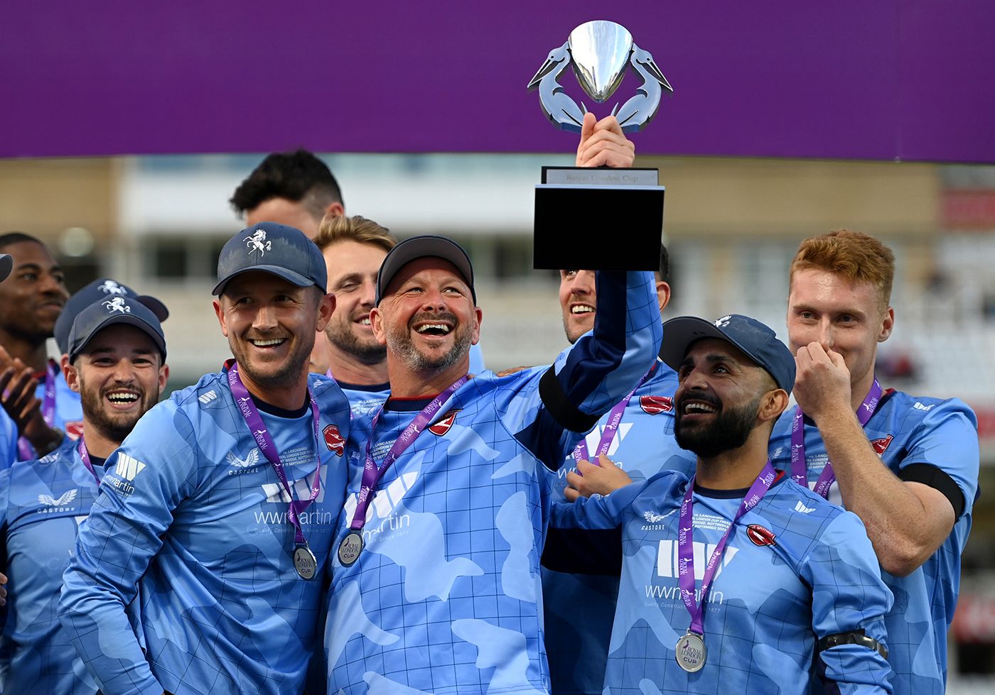 Joe Denly and Darren Stevens celebrate with the trophy