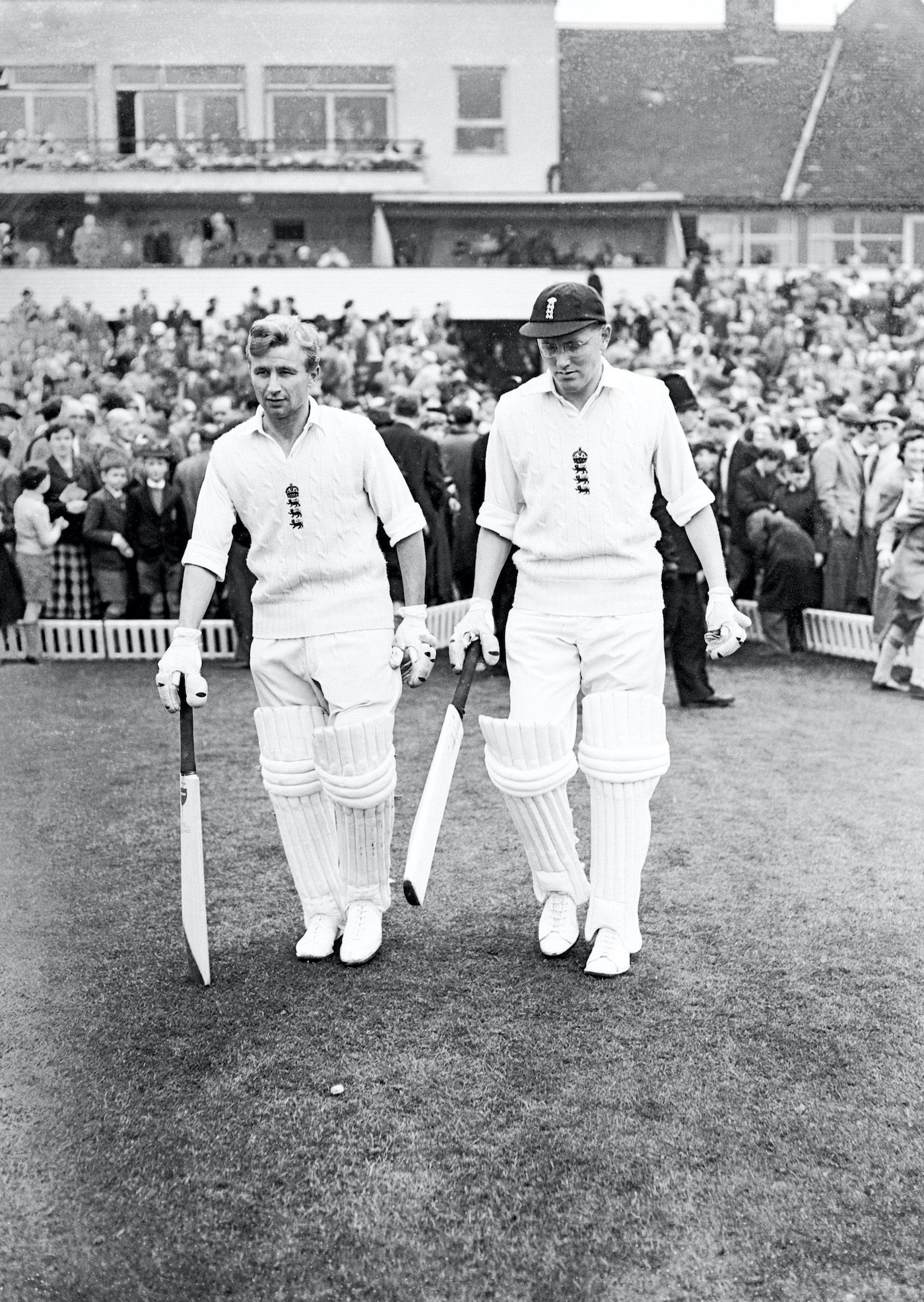Arthur Milton and Mike Smith walk out to open the batting in England's first innings
