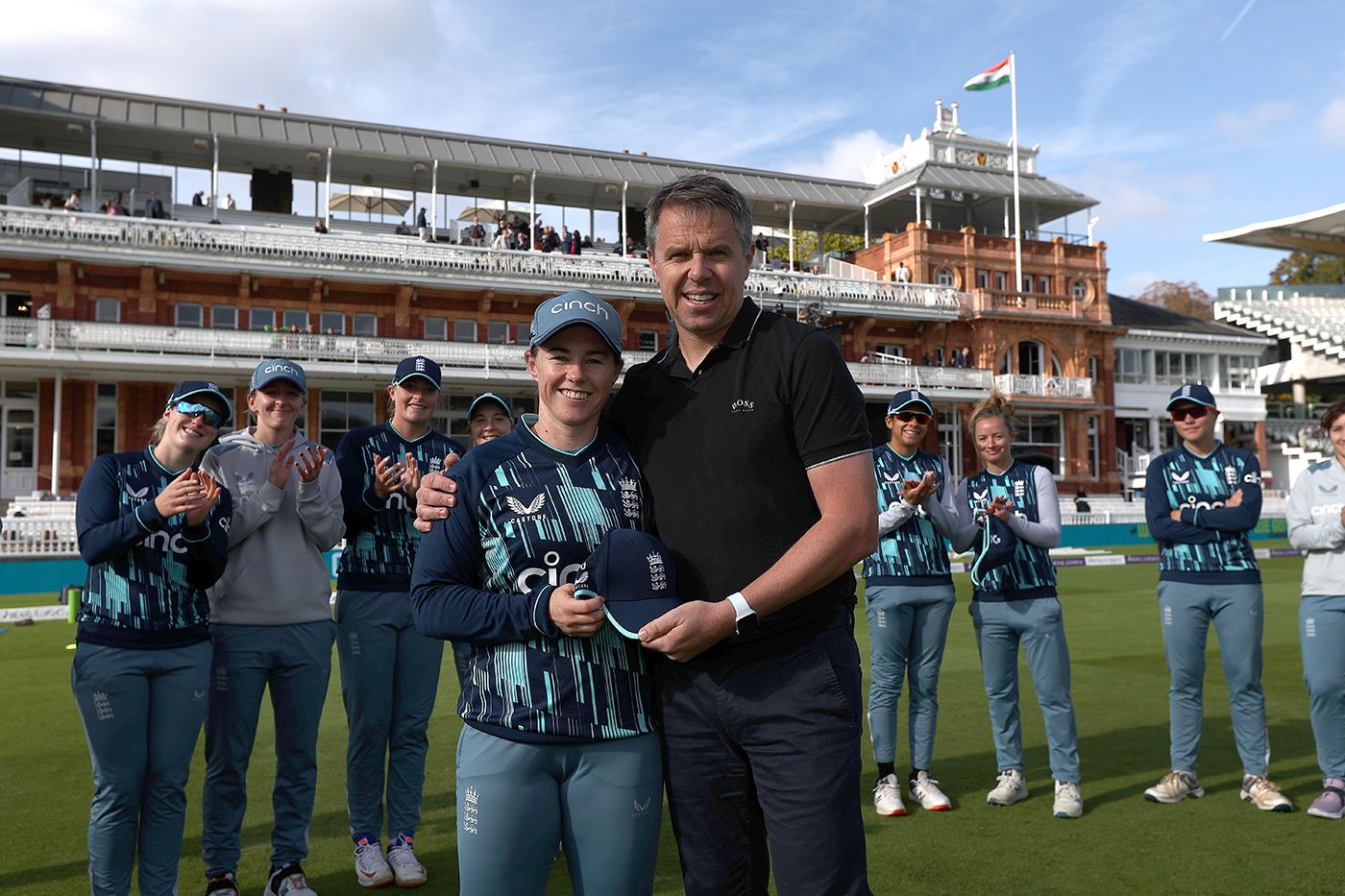 Tammy Beaumont receives her 100th ODI cap from Carl Crowe