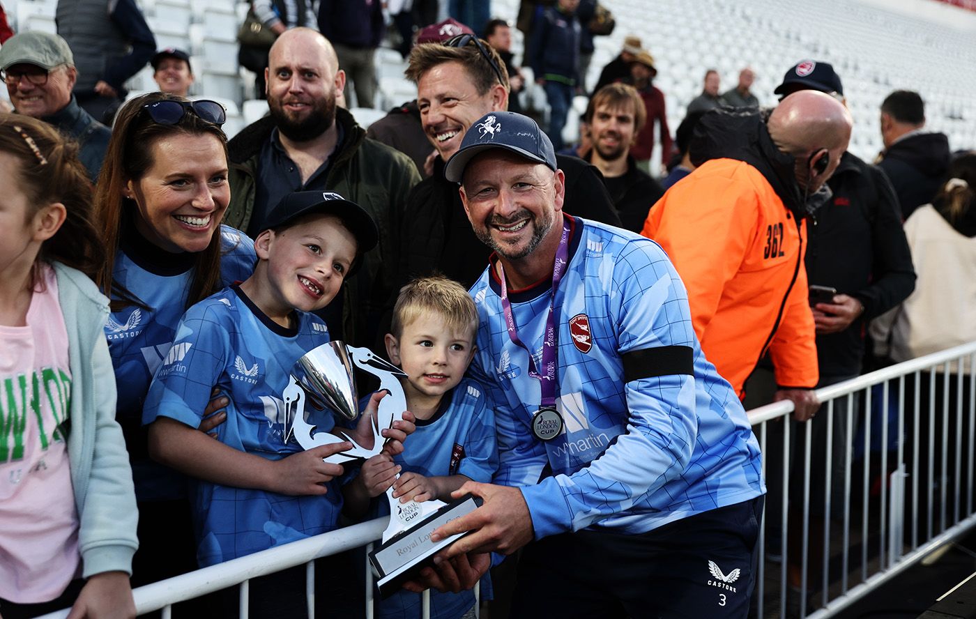 Darren Stevens poses for photos with young fans