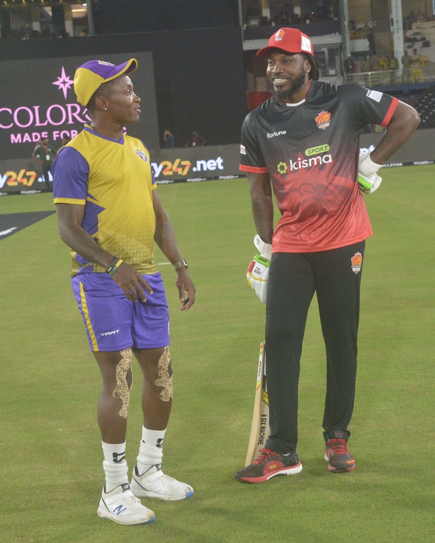 Fidel Edwards and Chris Gayle catch up before the game