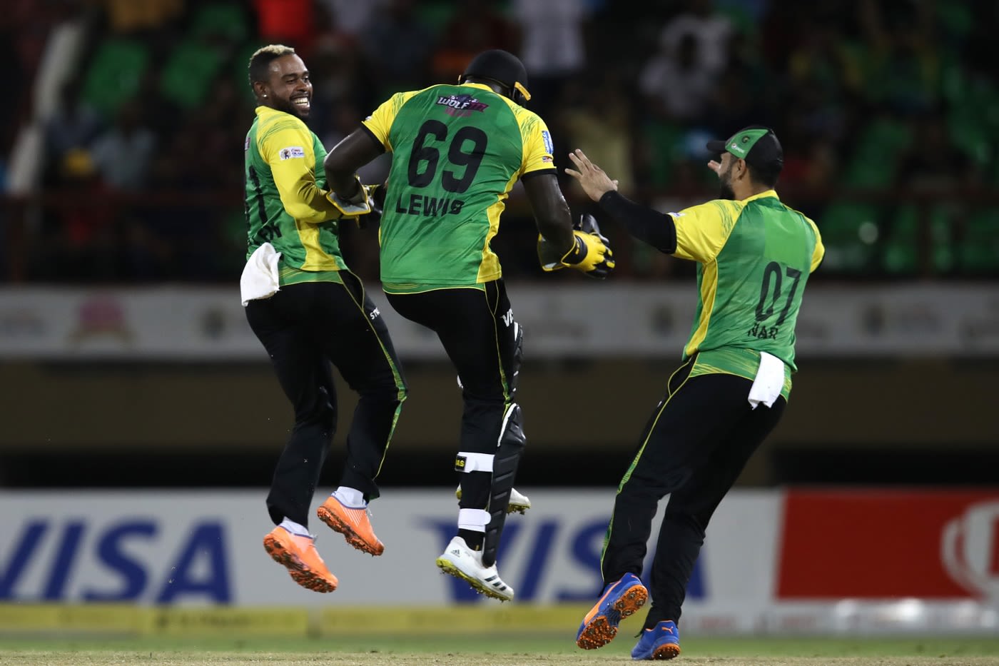 Fabian Allen, Kennar Lewis and Mohammad Nabi celebrate Faf du Plessis' wicket