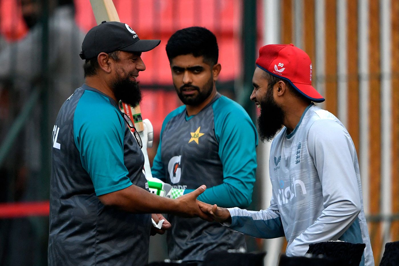Saqlain Mushtaq shakes hands with Adil Rashid