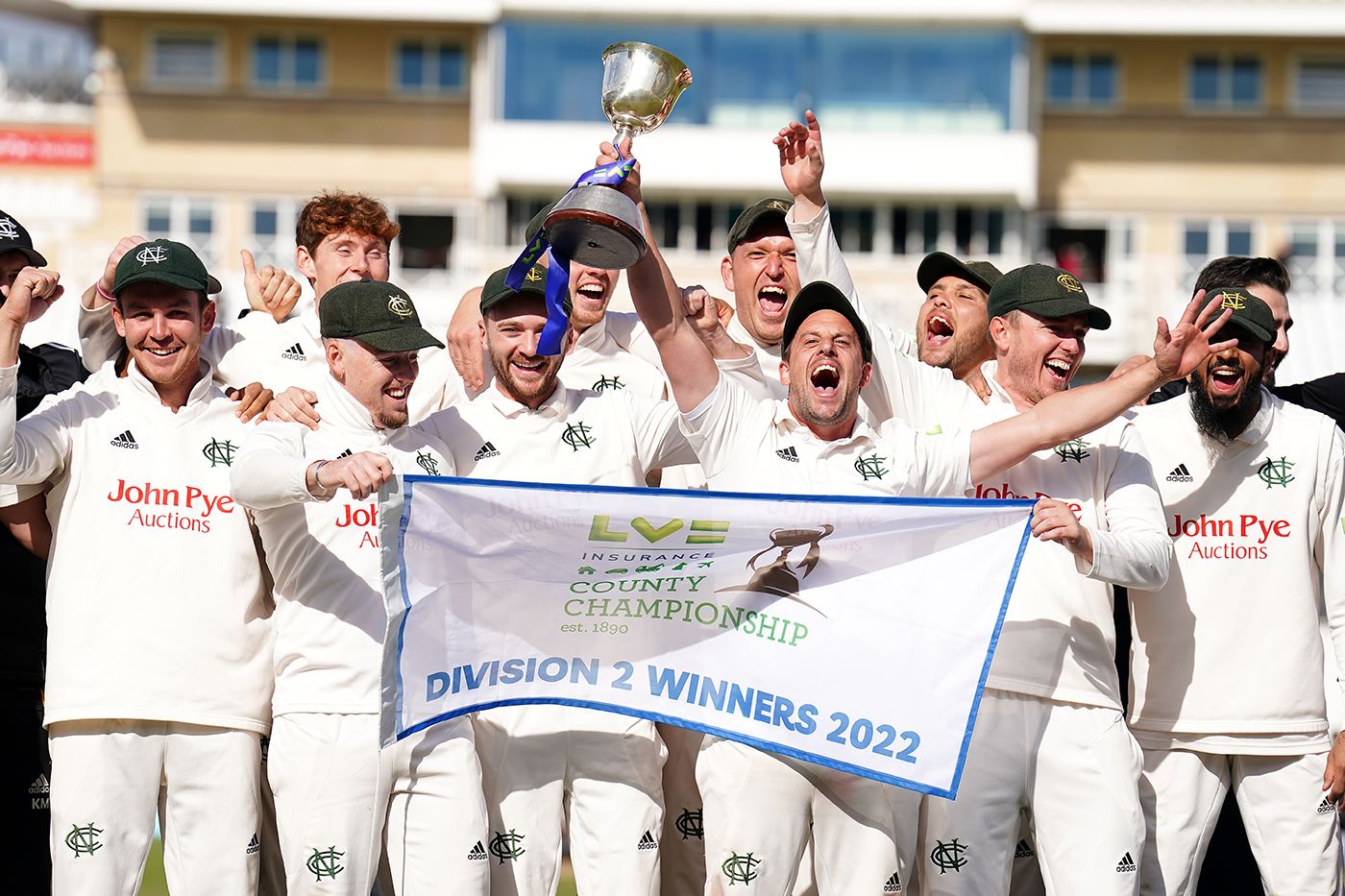 Steve Mullaney lifts the Division Two trophy