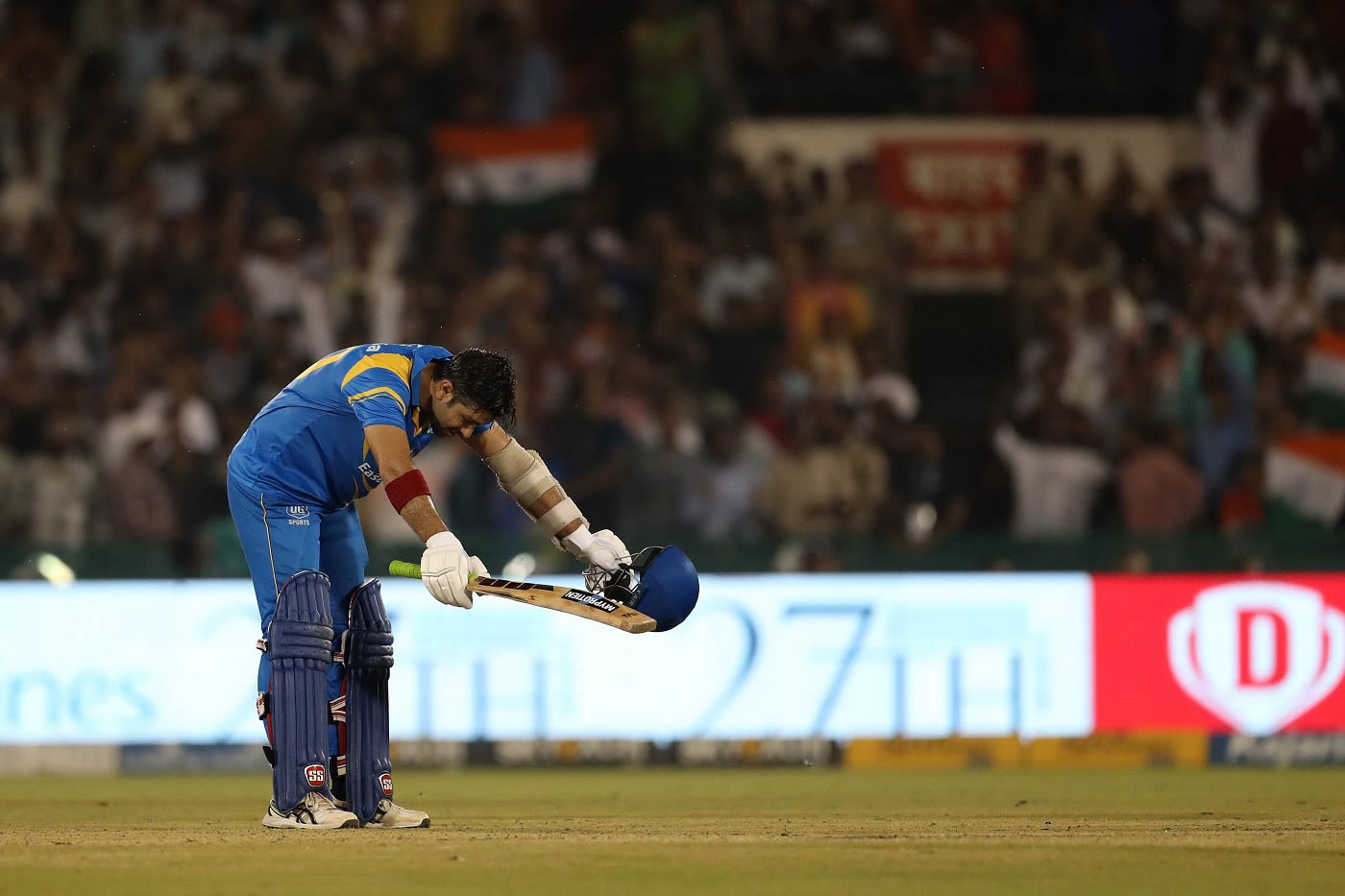 Naman Ojha celebrates after bringing up his century