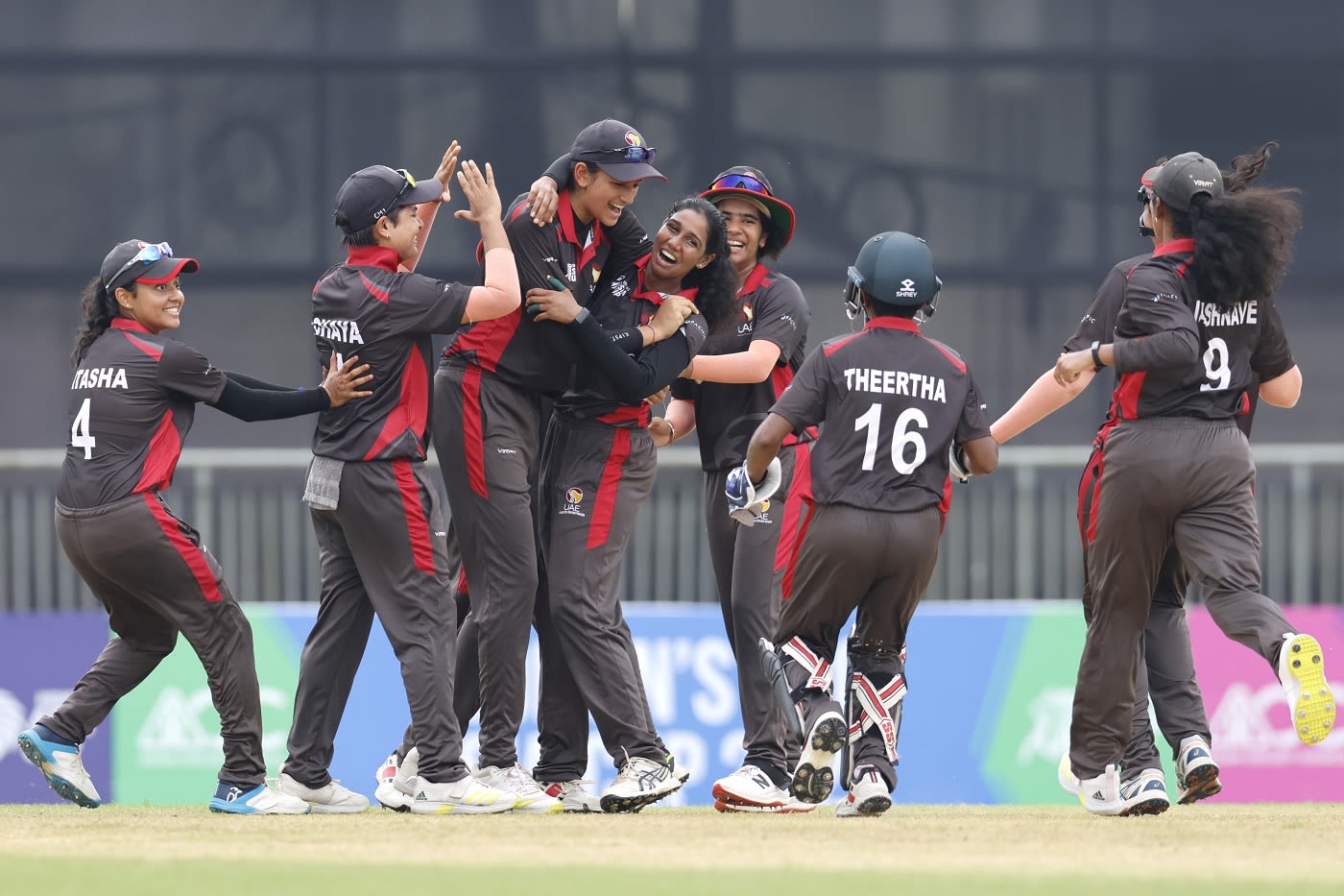 The UAE players congratulate Suraksha Kotte after she dismissed Hasini Perera