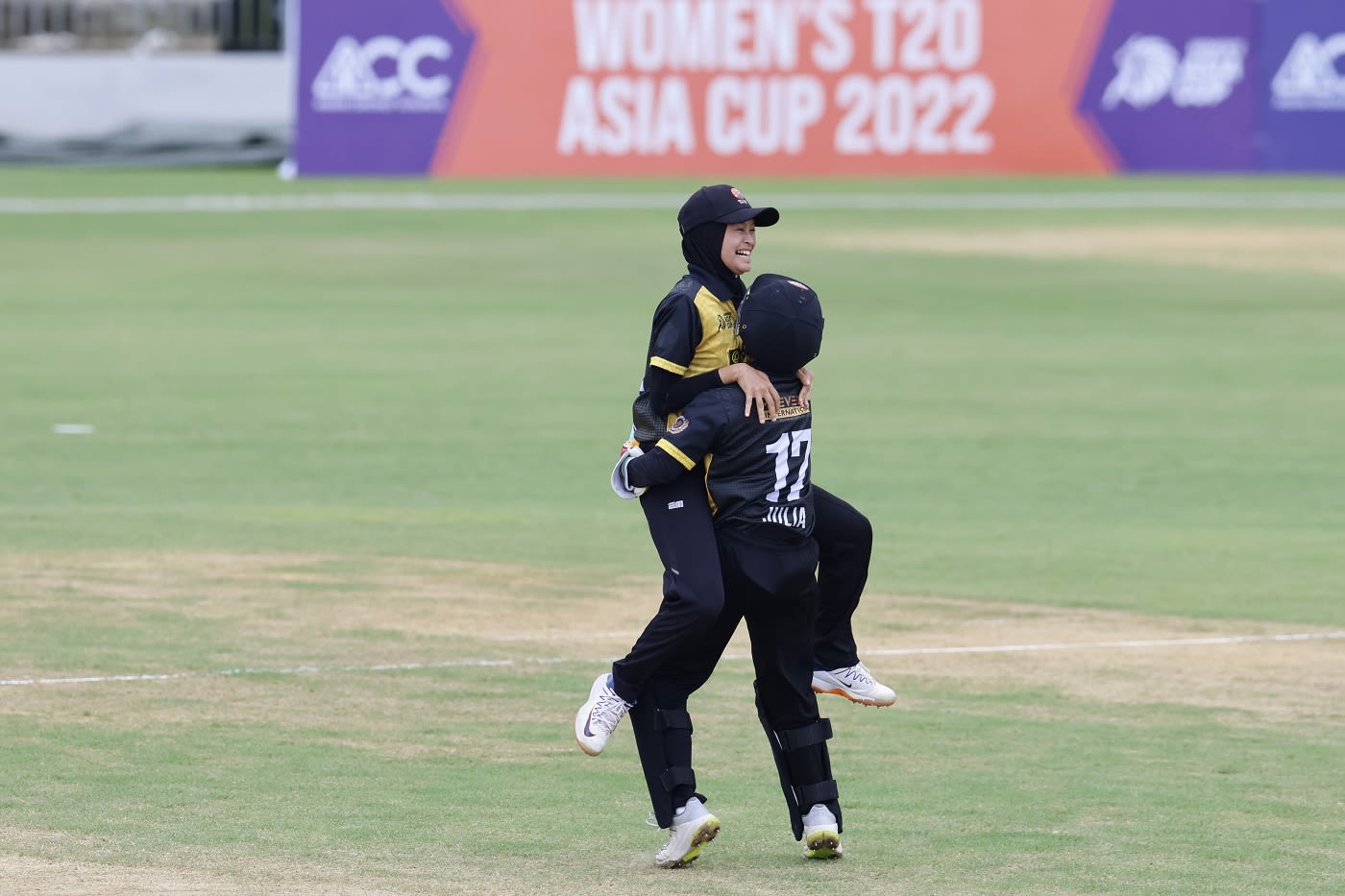 Nur Dania Syuhada, 17, took two wickets in her only over and almost picked up a third