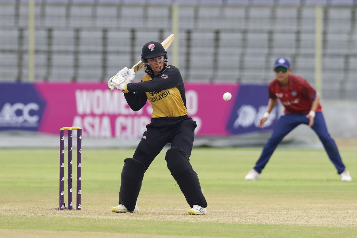 Elsa Hunter of Malaysia prepares to hit the ball