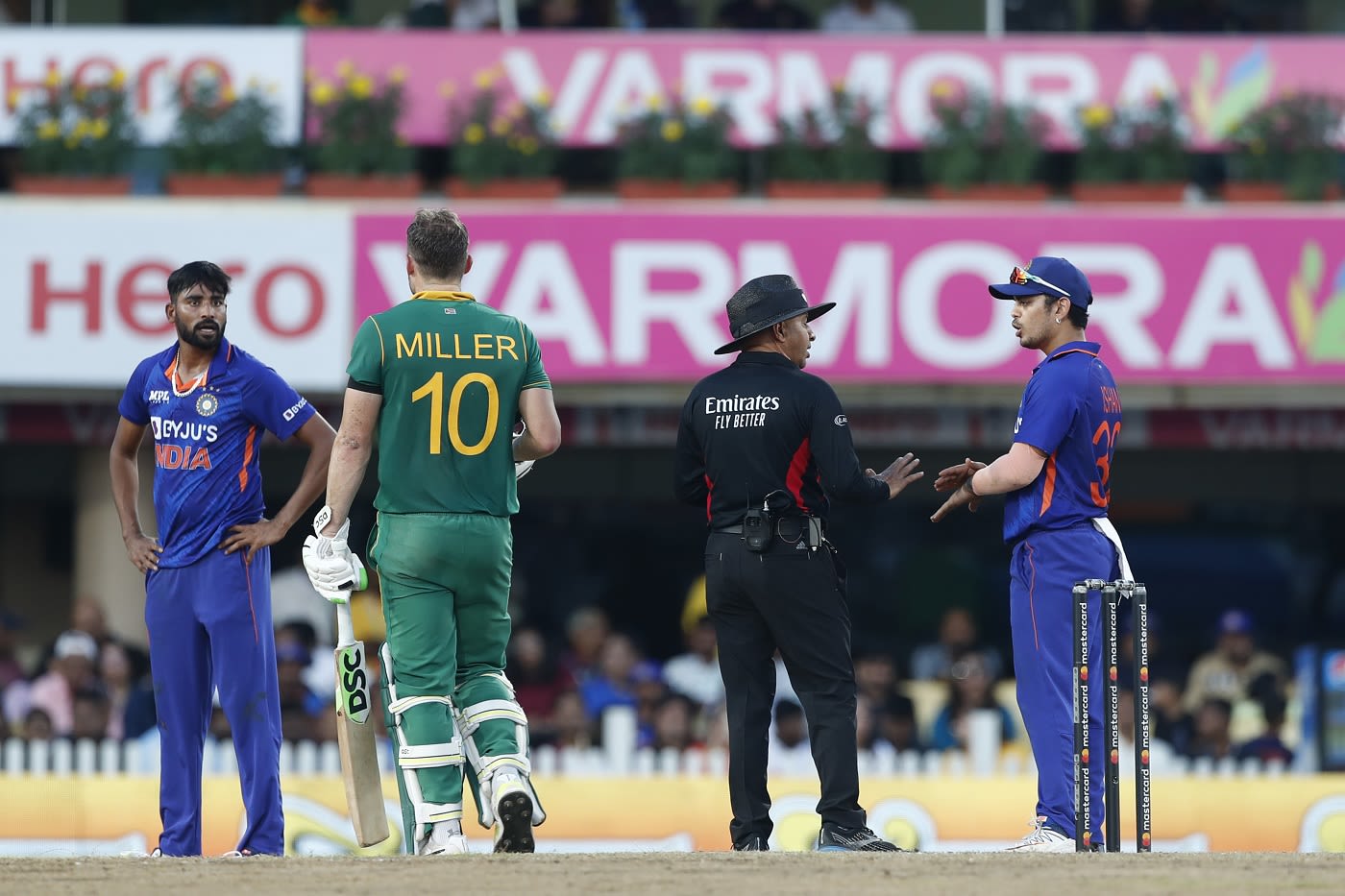 Mohammed Siraj and David Miller exchange looks, as Ishan Kishan argues with umpire Virender Sharma regarding a decision