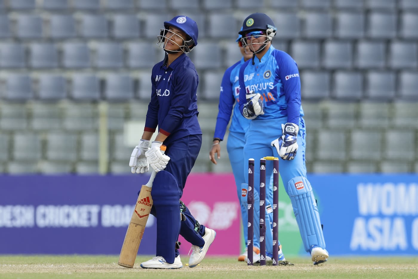 Natthakan Chantham is dejected after chopping a sharp-spinning delivery from Deepti Sharma onto her stumps
