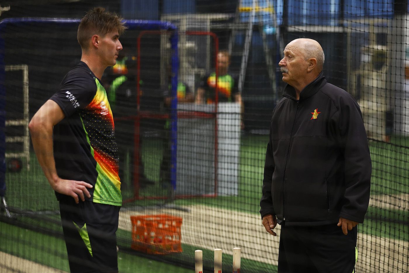 Brad Evans speaks with Dave Houghton during a training session