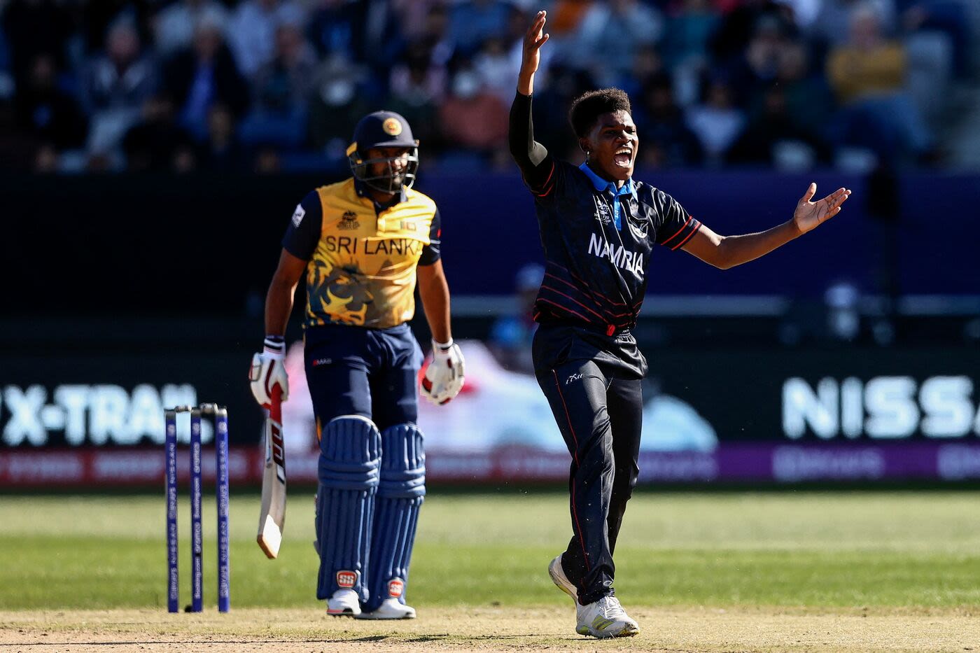 Ben Shikongo appeals for an lbw against Bhanuka Rajapaksa that would have given him his hat-trick