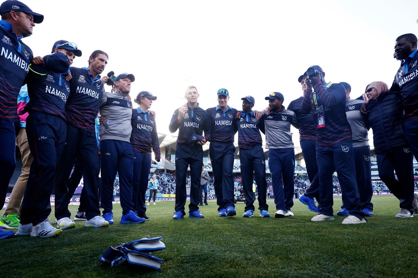 The Namibia players get together in a huddle after their win over Sri Lanka
