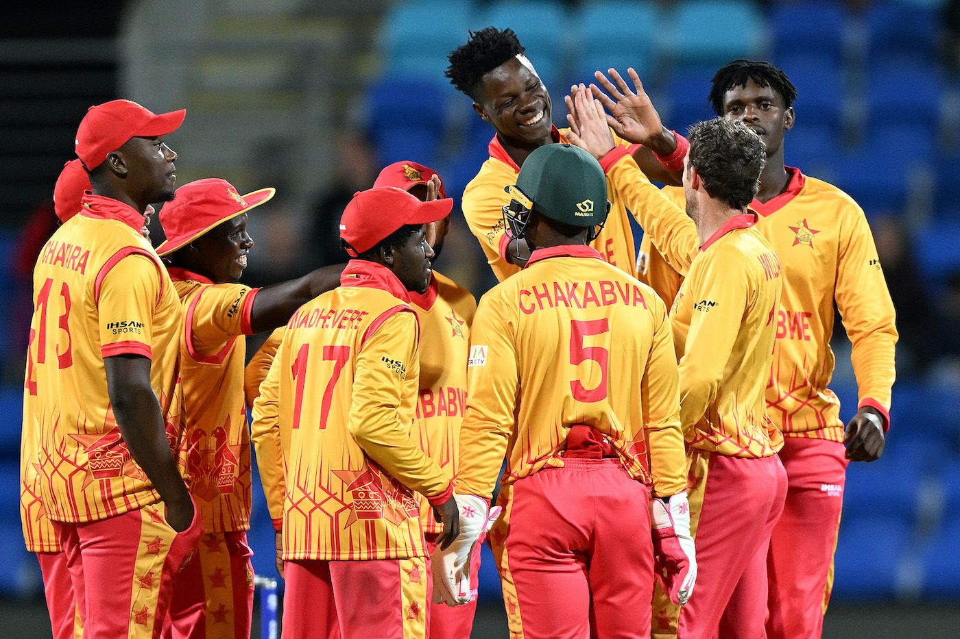 Zimbabwe's players celebrate after Johnson Charles' run out