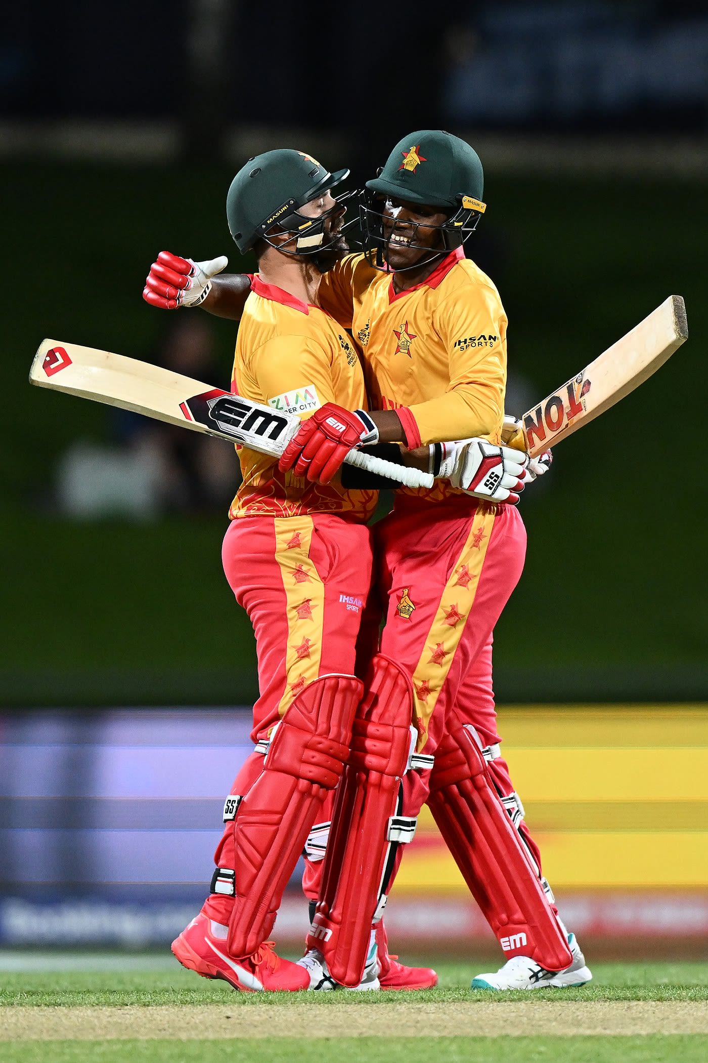Ryan Burl hugs Milton Shumba after hitting the winning runs