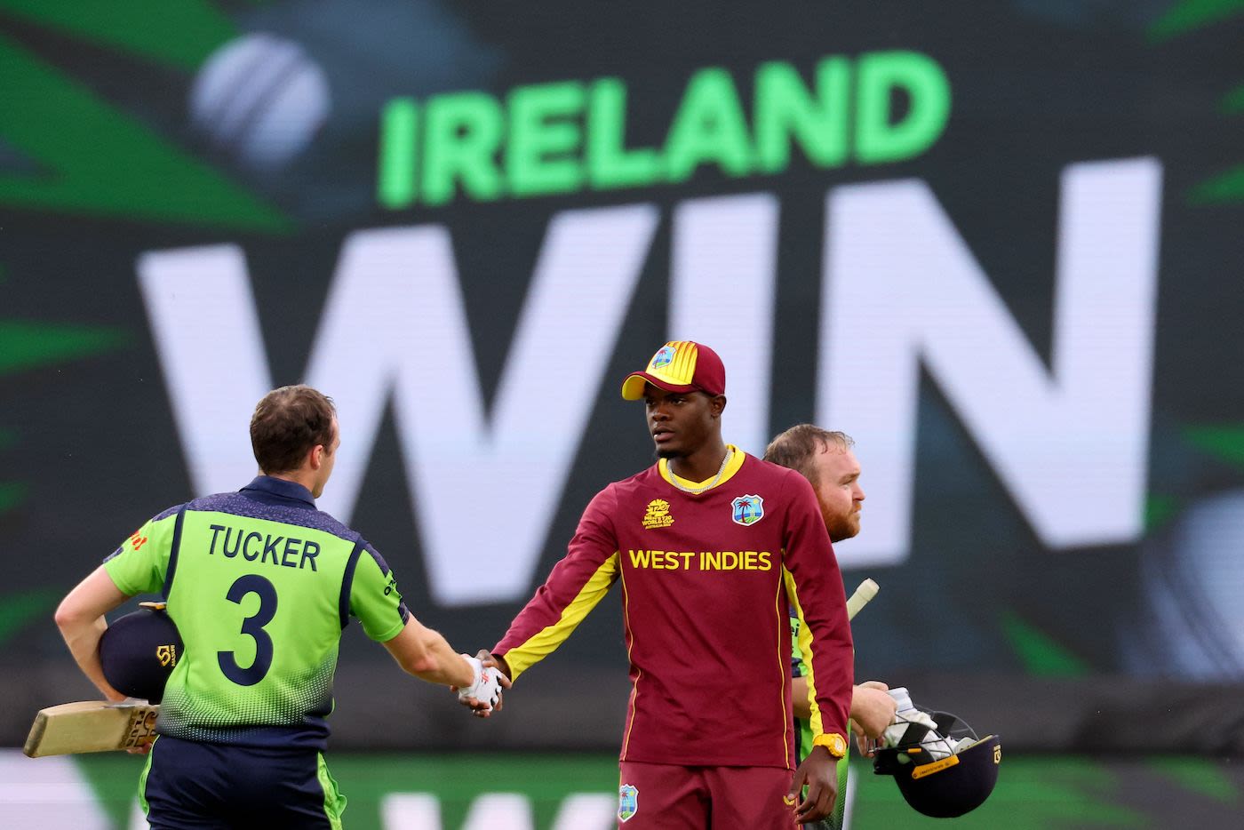 Lorcan Tucker commiserates with Alzarri Joseph after Ireland toppled West Indies