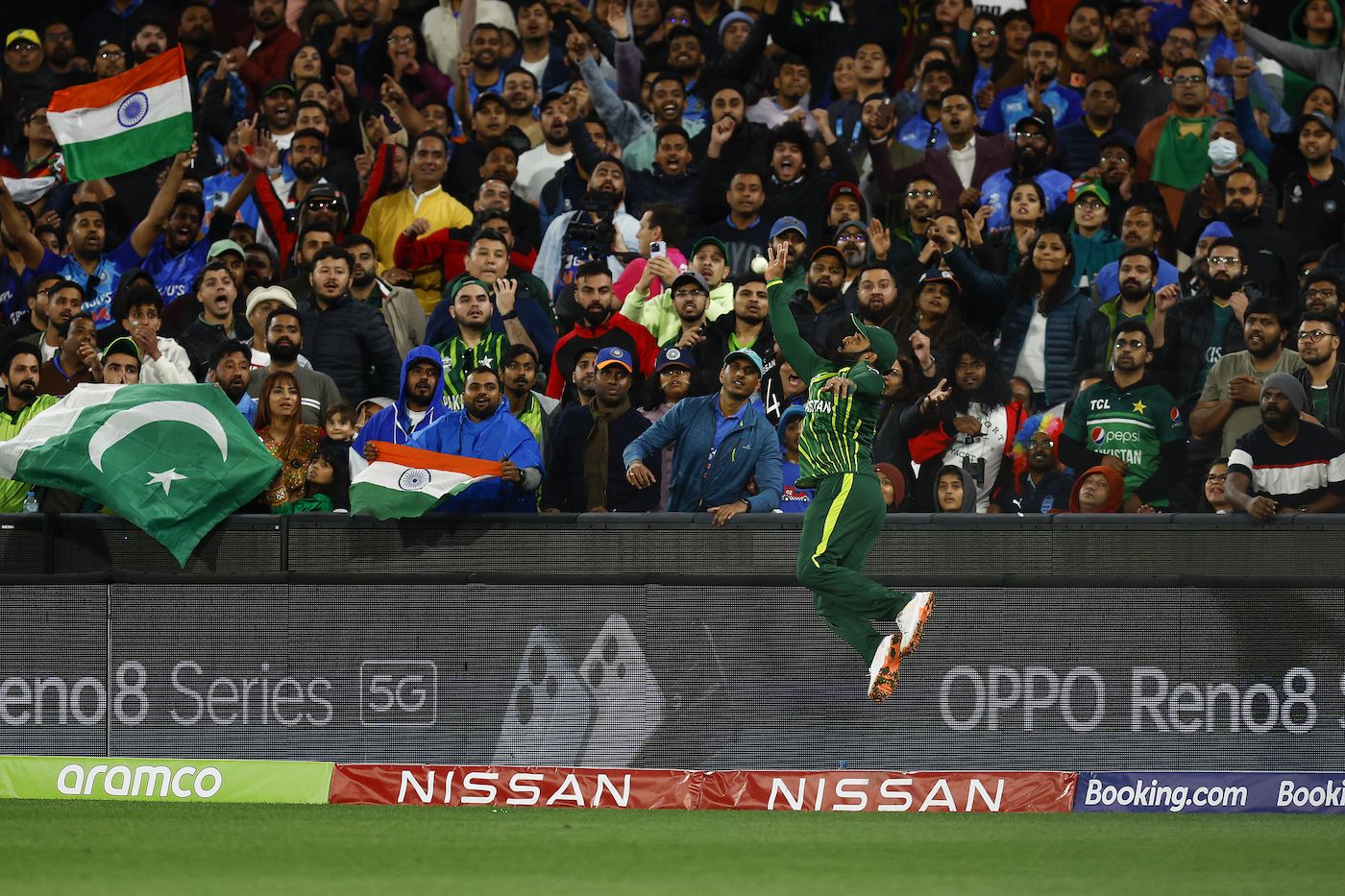 Asif Ali leaps in vain to try and prevent a six in the final over