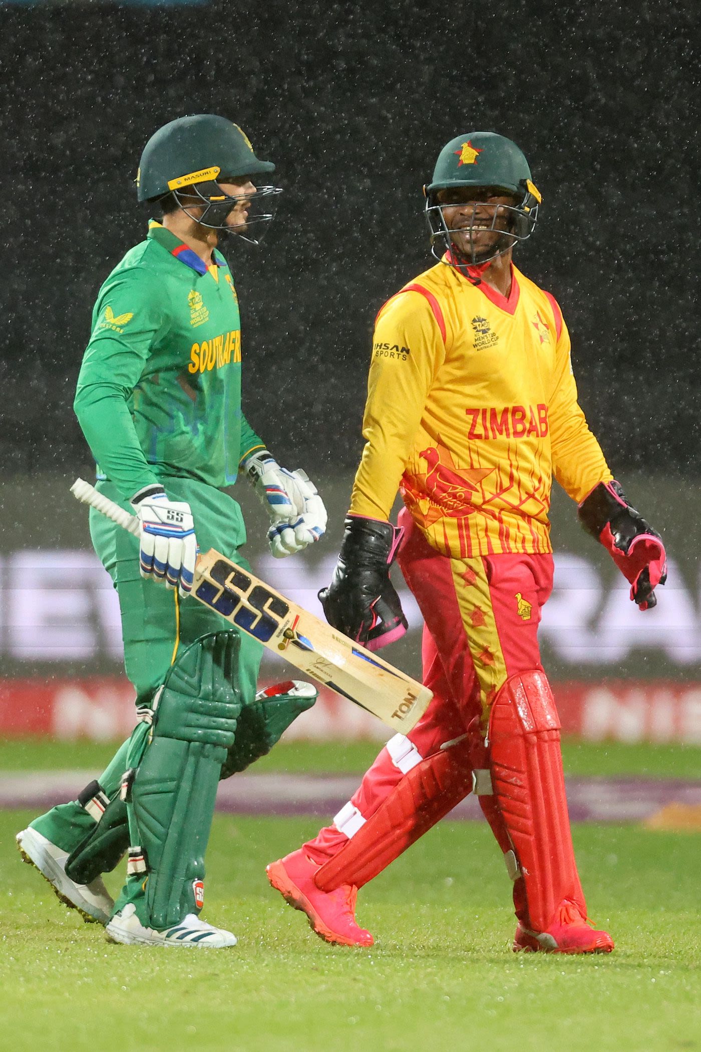 Regis Chakabva understandably looks happier than Quinton de Kock as they walk off one last time